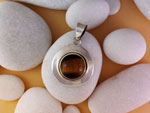 Ethnic sterling silver pendant with a tiger's eye gem.. Ref. XCT
